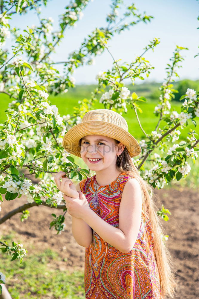 Similar – Image, Stock Photo Little baby is touching fresh spring leaves in her mother’s hug