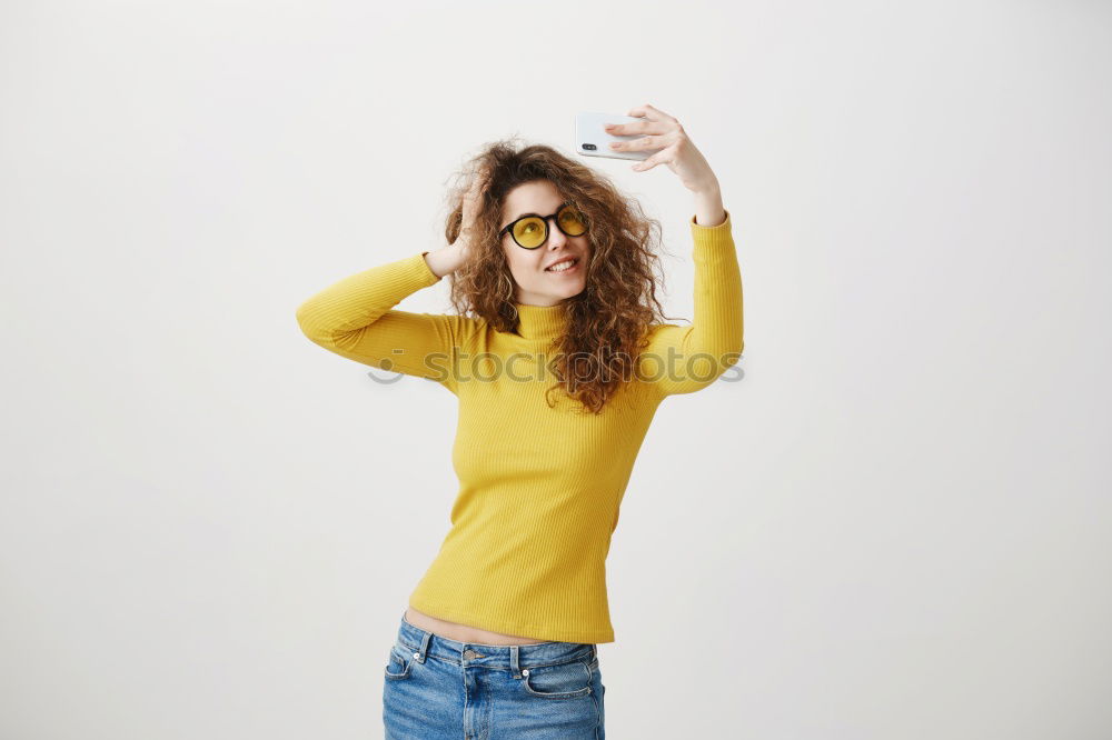 Similar – Cheerful woman in yellow jacket