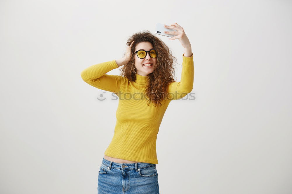 Similar – Who am I? Young woman holding a mirror in front of her face. Faceless, identity not recognizable, the mirror is showing her backhead. Hiding her face.