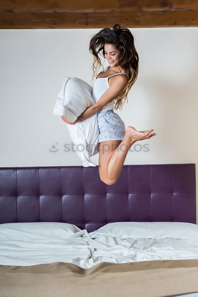 Similar – beautiful kid girl playing and jumping on bed