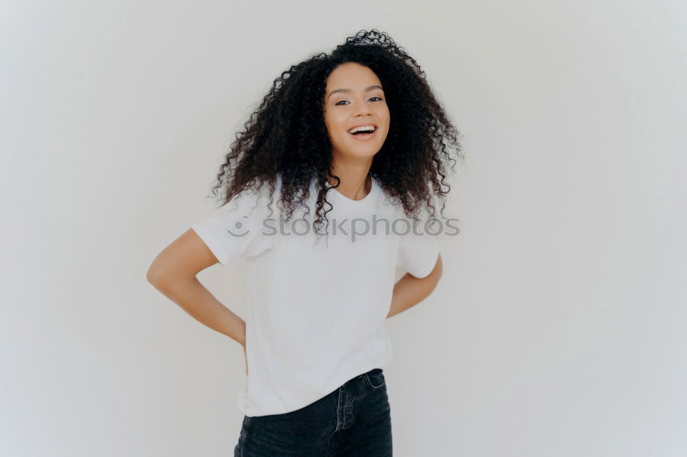 Young happy woman surrounded by green leaves