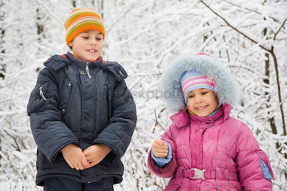 Similar – Cute little children playing in snow at a winter day. People having fun outdoors. Concept of Happy new year.