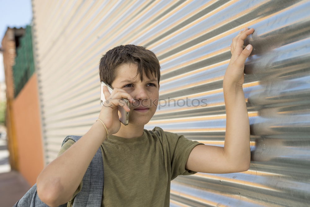 Similar – Image, Stock Photo Portrait of a young student leaning on wall while looking camera