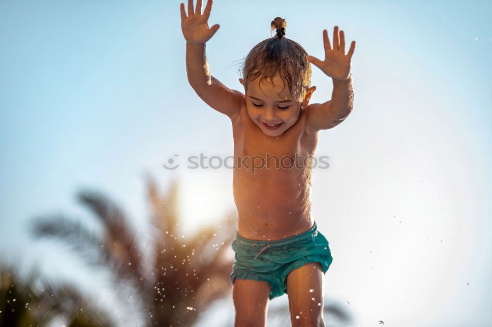 Similar – Playful girl standing in pier near lake