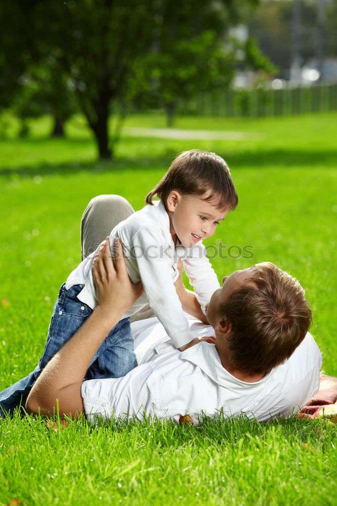 Similar – Image, Stock Photo Father and son playing at the park on bench at the day time.