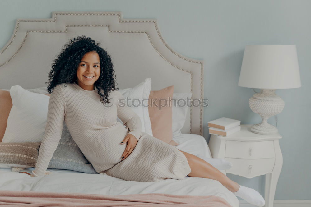 Similar – Happy beautiful young black woman relaxed sitting in the bed