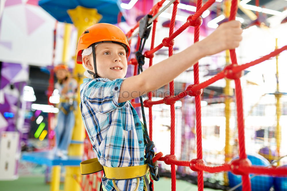 Similar – Image, Stock Photo Child climb a climbing wall