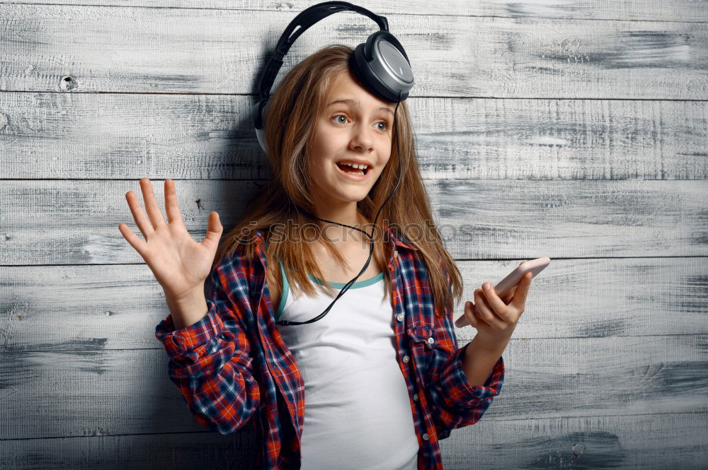 Similar – Angry young woman holding a retro clock