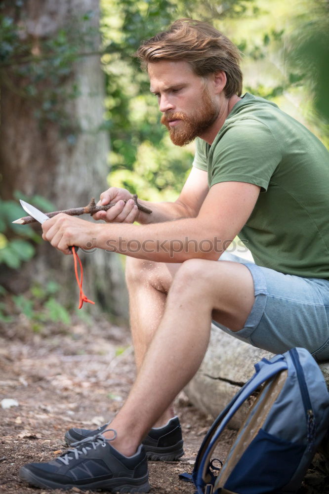 Similar – Image, Stock Photo Portrait of a young male adjusting the saddle on his horse