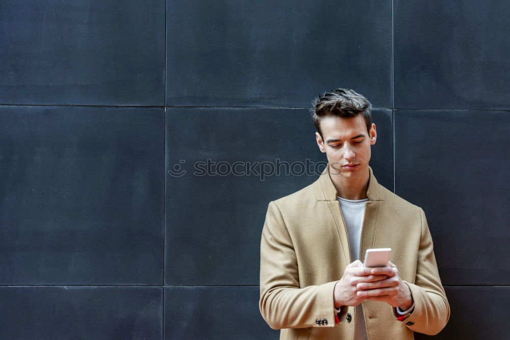 Similar – Image, Stock Photo Elegant Young Businessman in the Street Using a Mobile Phone