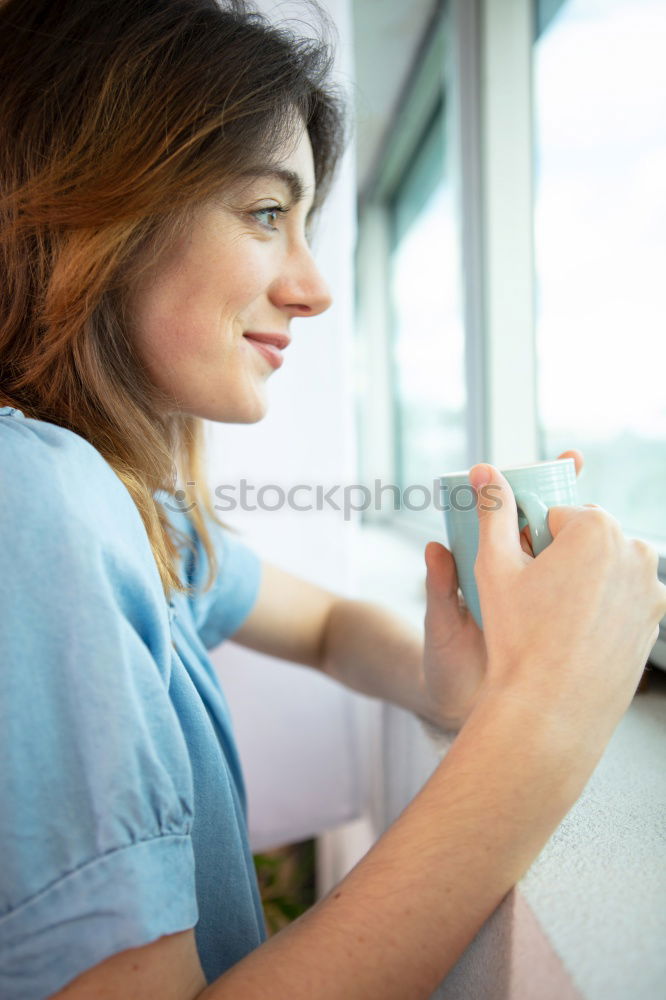 Similar – Woman posing sitting in outside cafe