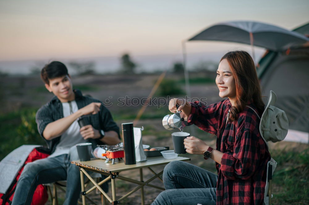 Similar – Image, Stock Photo Couple pausing while doing trekking