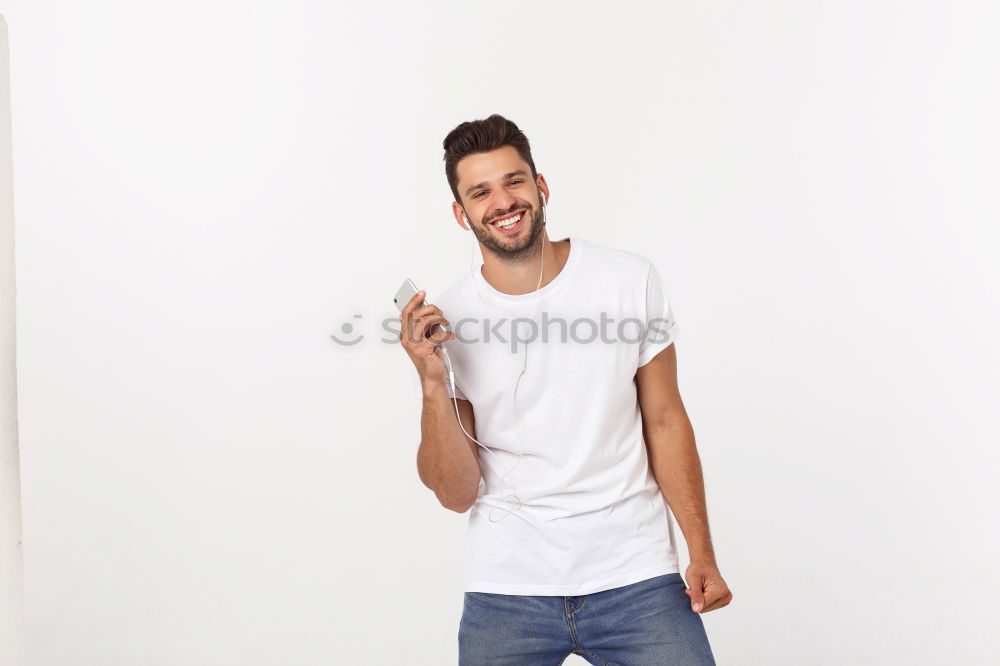 Similar – young handsome man with t-shirt against a wall in street