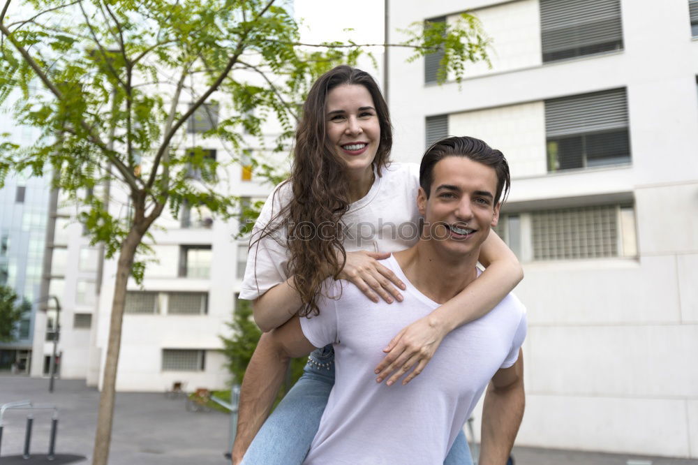 Similar – Image, Stock Photo Beautiful young couple hugging, looking at camera and smiling