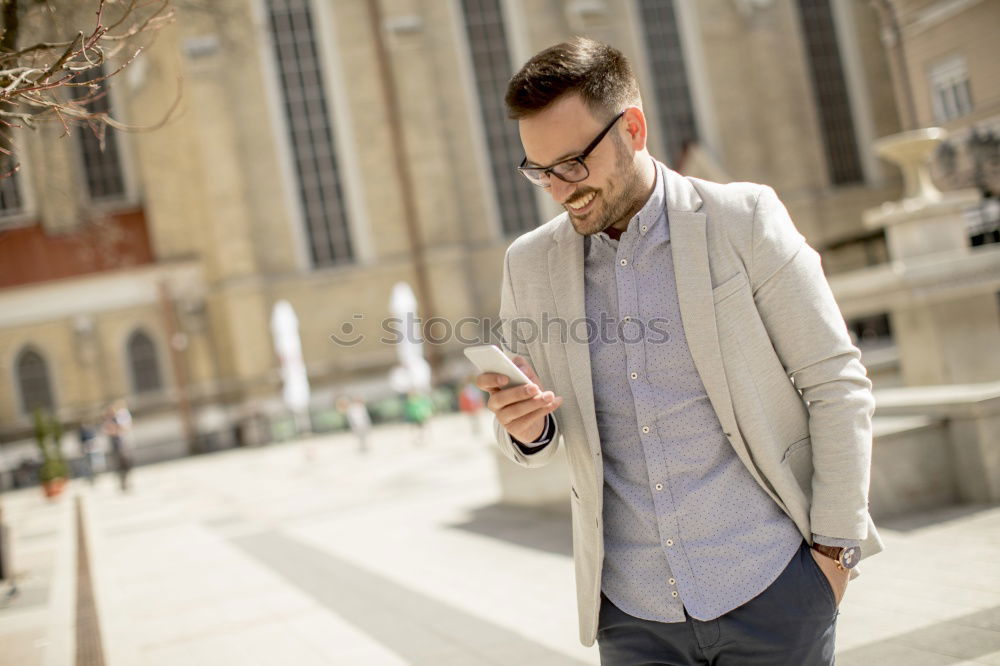 Similar – Traveler using smartphone on city