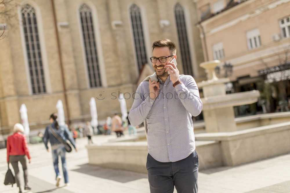 Similar – Traveler using smartphone on city