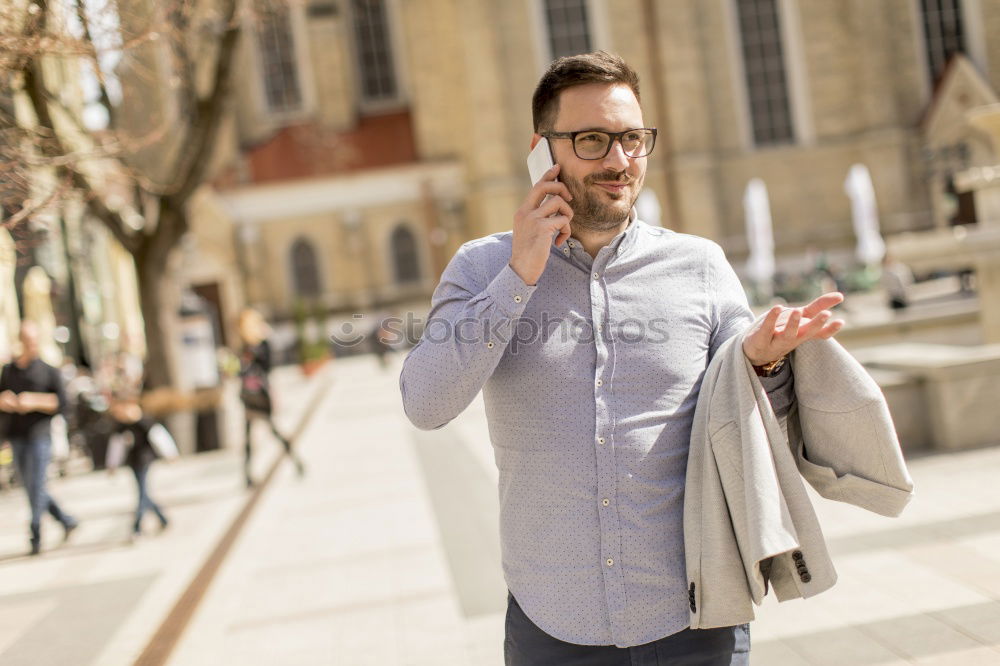 Similar – Traveler using smartphone on city