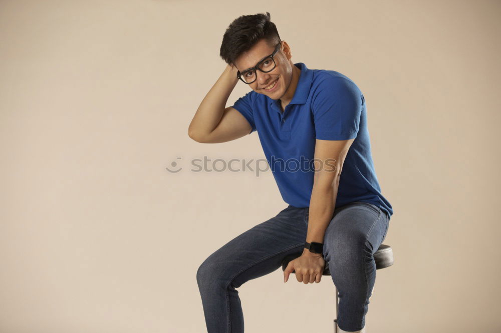 Similar – Young man sitting on the floor in urban background