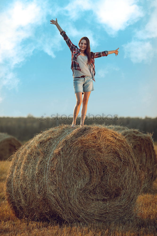 Similar – Woman in big round hat in middle of wheat field