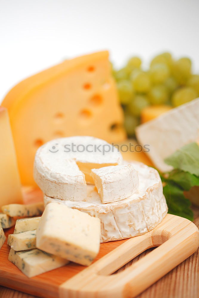 Similar – Image, Stock Photo parmesan cheese on plate of wood