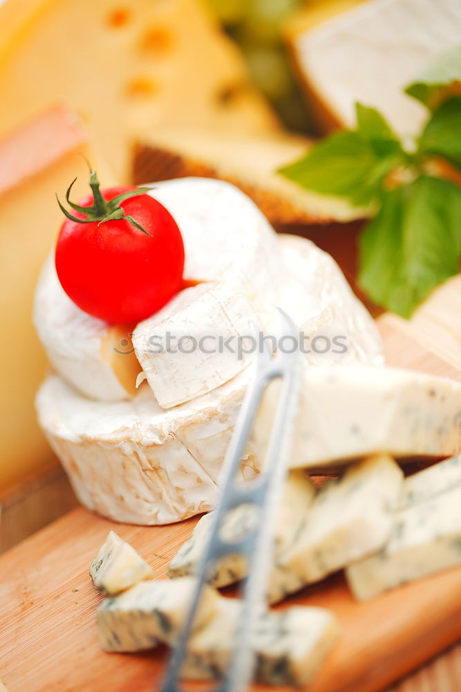 Similar – Image, Stock Photo parmesan cheese on plate of wood