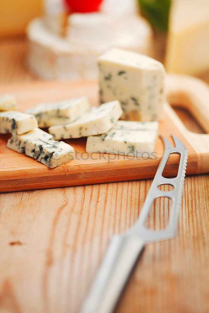 Image, Stock Photo parmesan cheese on plate of wood