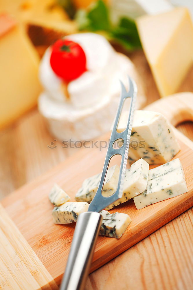 Similar – Image, Stock Photo parmesan cheese on plate of wood