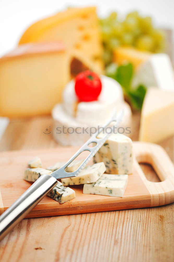 Similar – Image, Stock Photo parmesan cheese on plate of wood