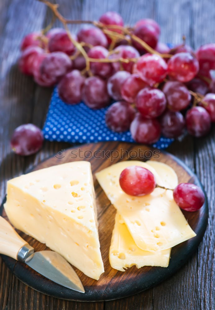 Similar – Image, Stock Photo Flammkuchen with grapes and sheep cheese bake