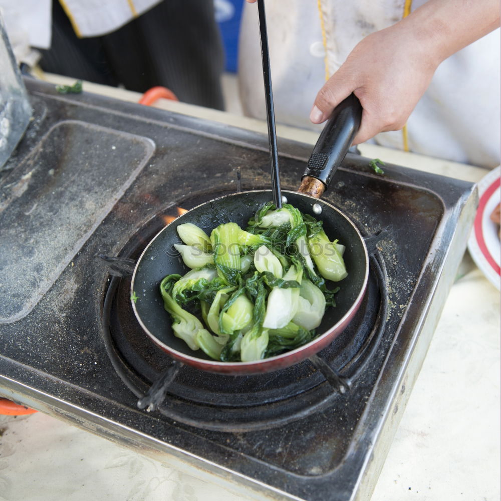 Similar – Korean hot pot and people taking food with chopsticks.