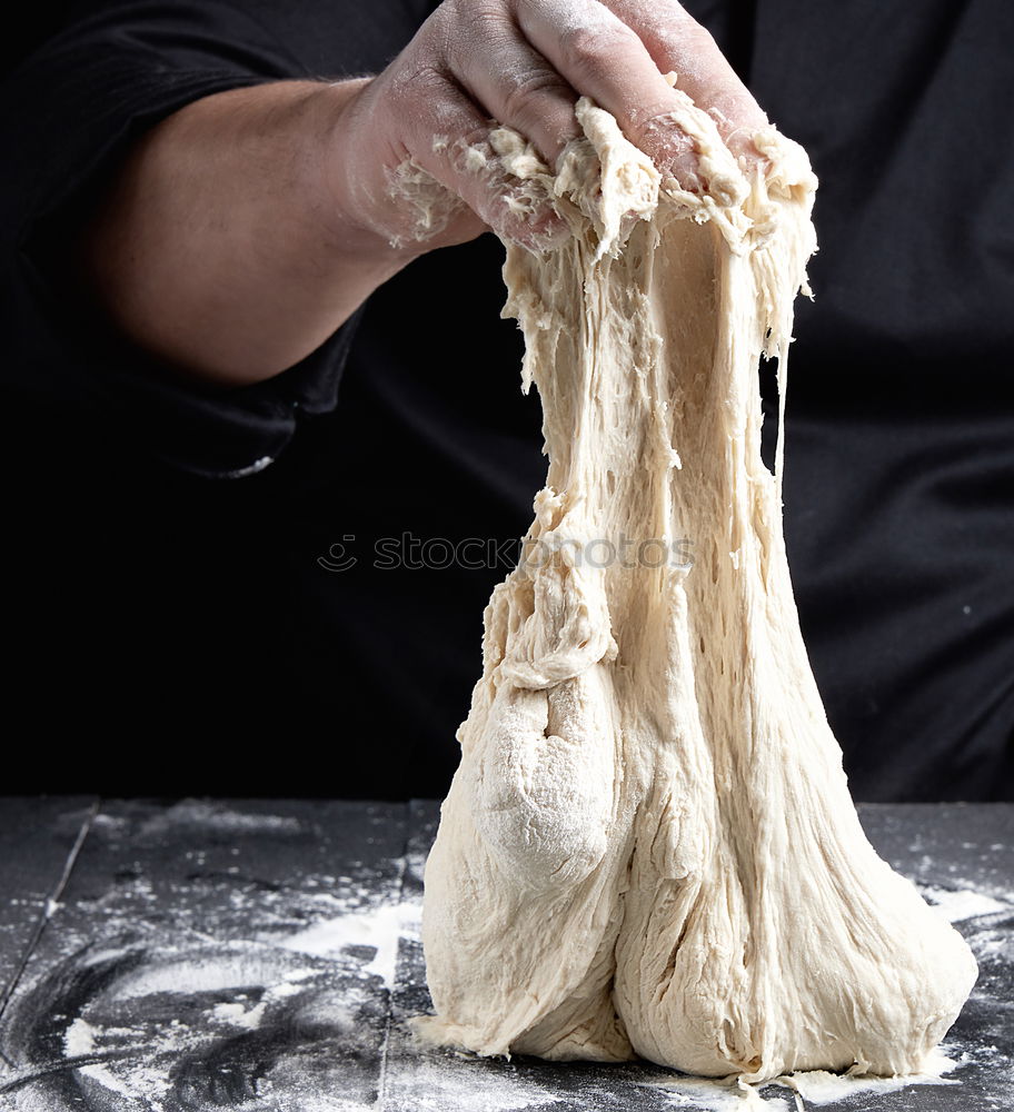 Similar – Image, Stock Photo male hands substitute white wheat flour dough