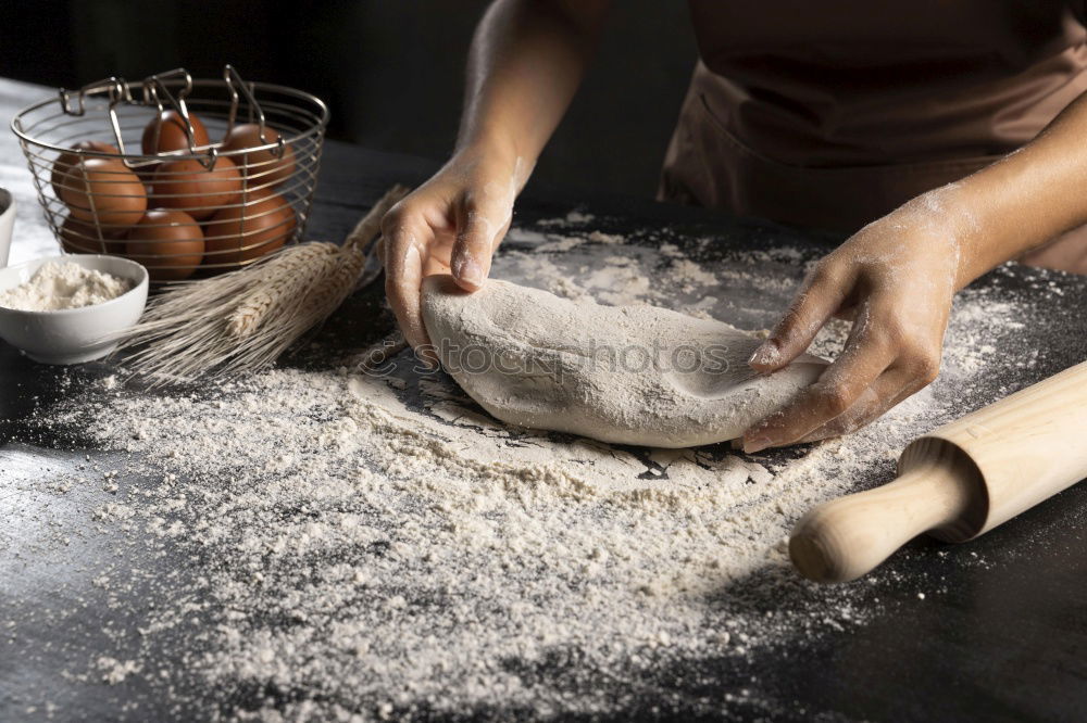 Similar – Image, Stock Photo Making homemade taglatelle with a pasta rolling cutter