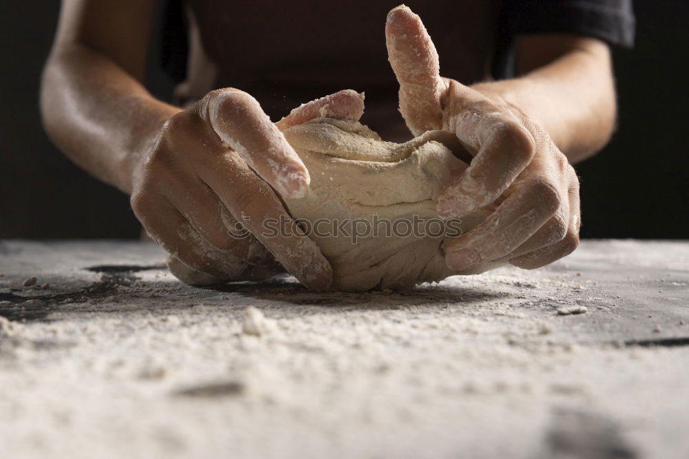 Similar – Hands of woodcarver make wooden bowl