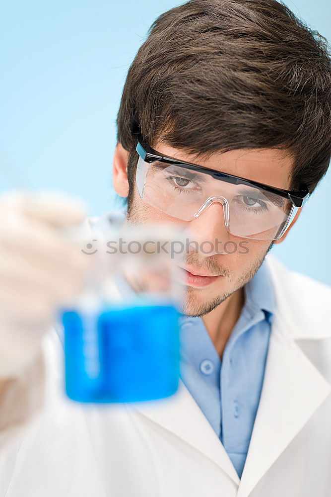 Similar – Image, Stock Photo Woman holding flask in lab