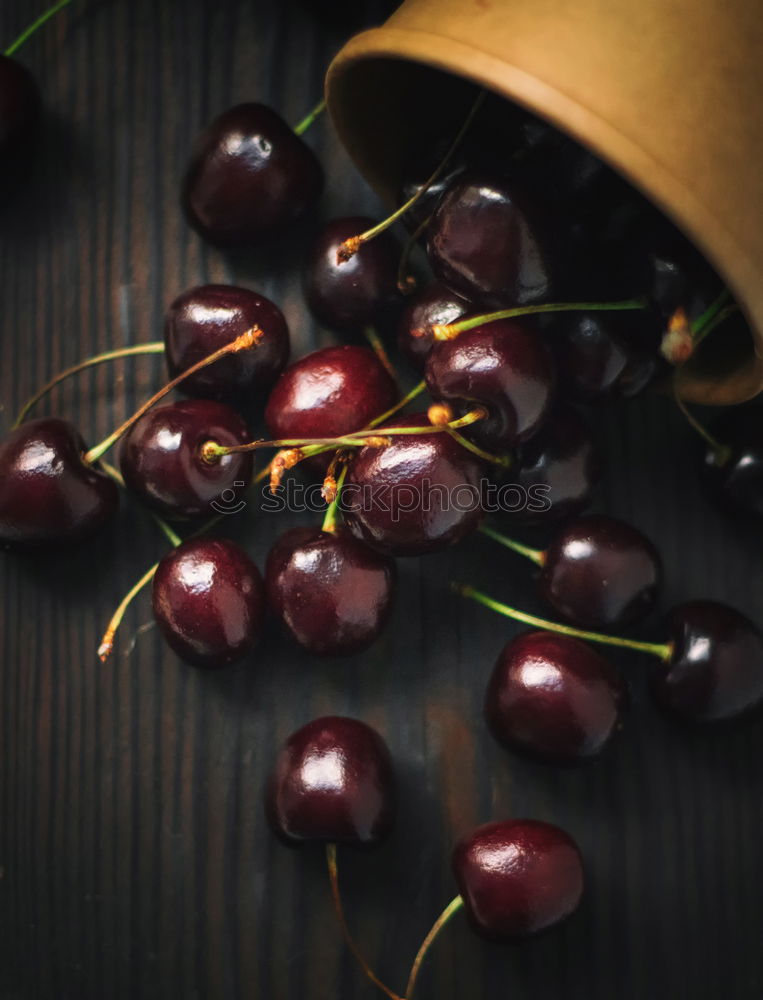 Similar – Sweet cherries in a blue bowl on a dark wooden table