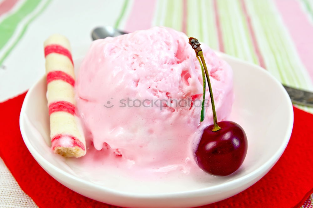 Similar – Pink sweet lemonade made of raspberry juice with frosted blackberries and strawberry blossom in a glass with sugar rim and drinking straw on striped tablecloth