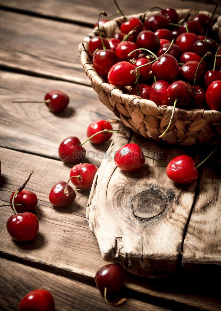 Similar – Image, Stock Photo Ripe red cherry in a paper bag