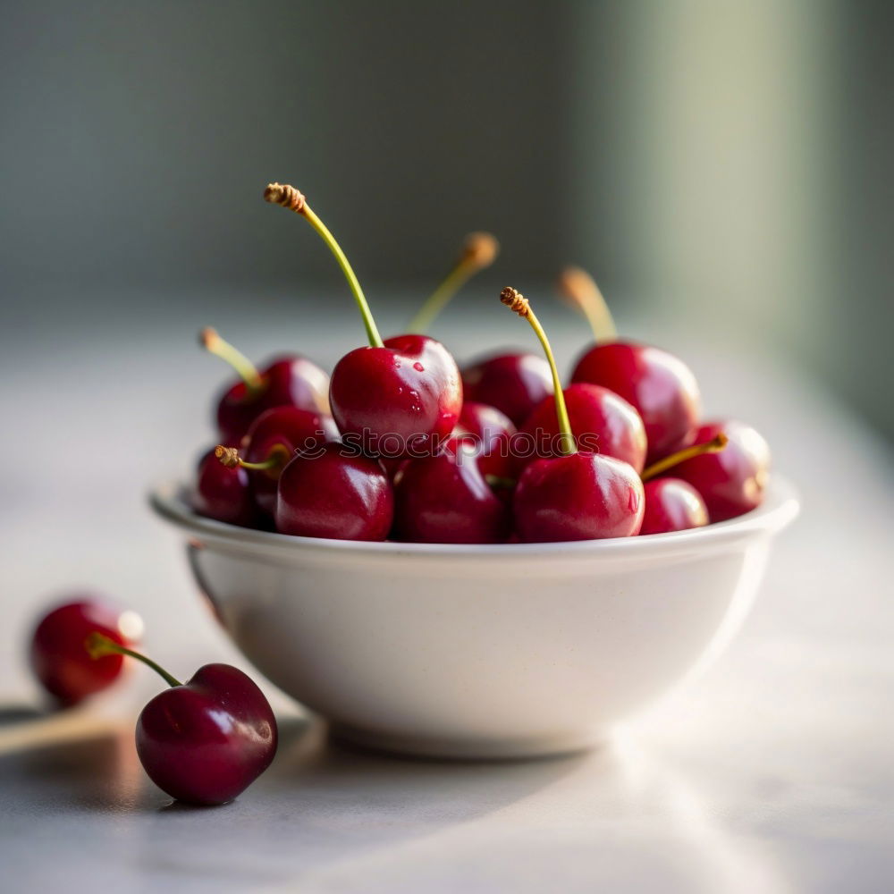 Similar – Sweet cherries in a blue bowl on a dark wooden table