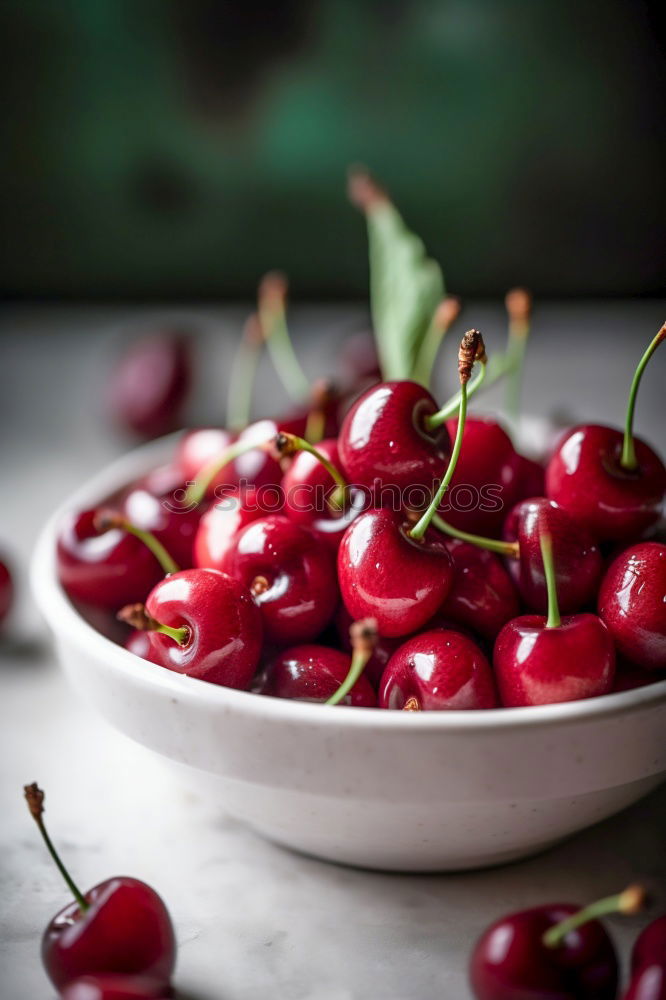 Similar – Sweet cherries in a blue bowl on a dark wooden table