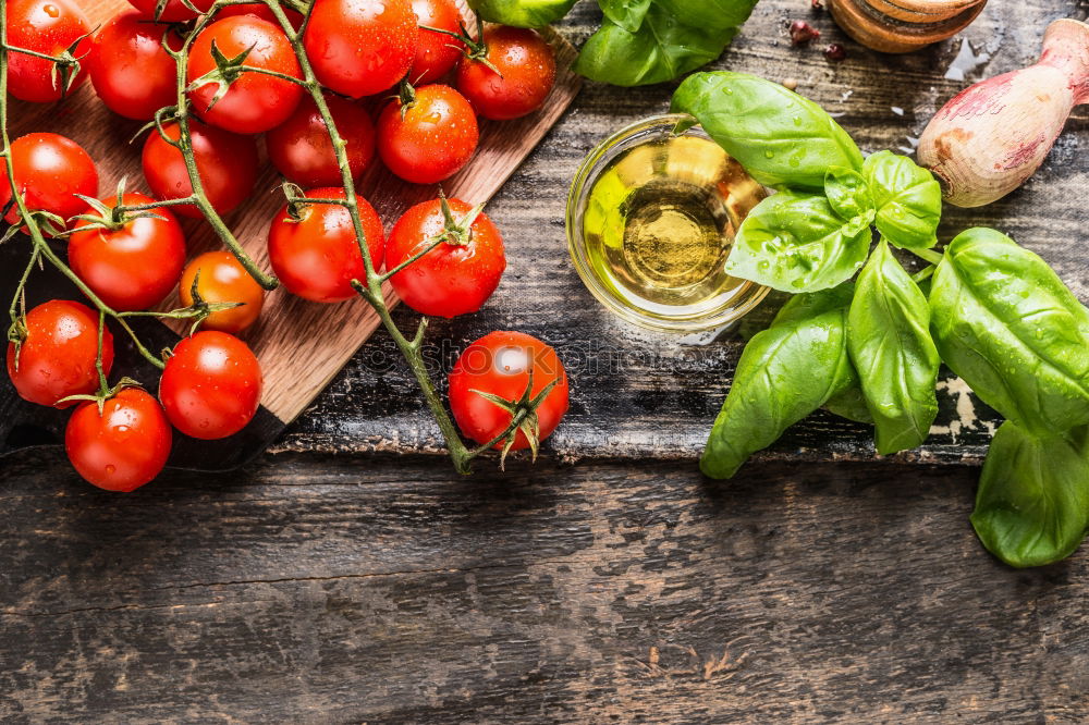 Similar – Fresh red tomatoes with herbs