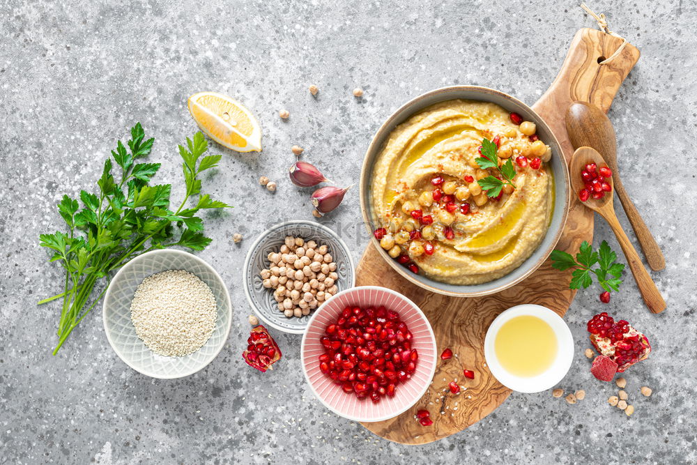 Similar – Couscous with vegetable ingredients in bowls