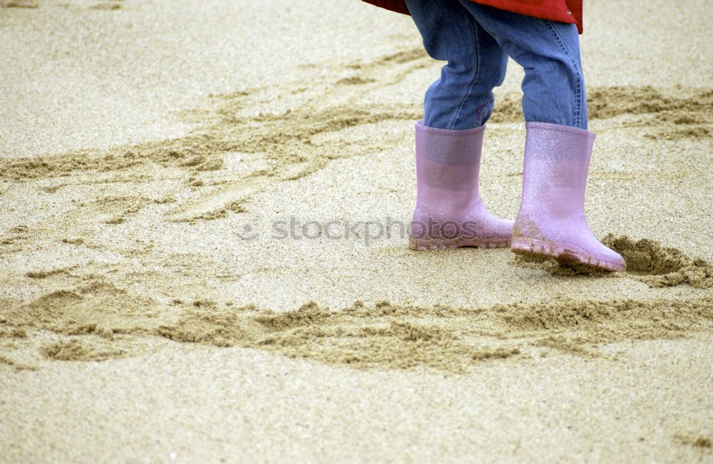 Similar – Rubber Boots Water Splashing