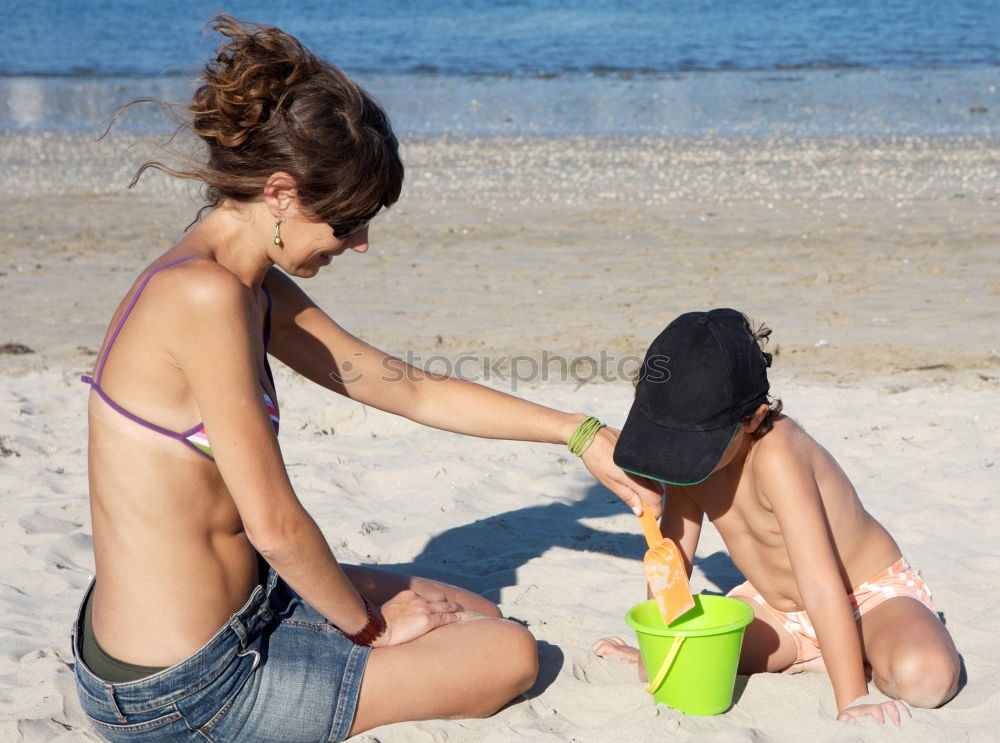 Similar – caucasian mother and son having fun at the beach