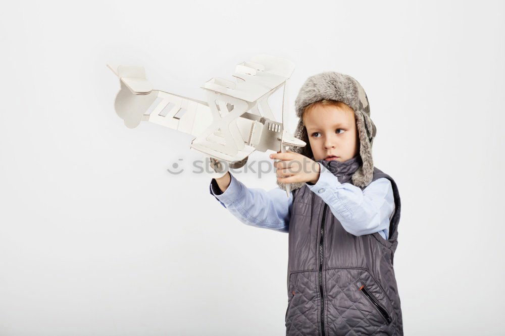 Similar – Boy holding figure on chess board