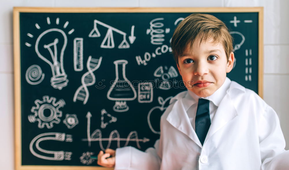 Similar – Child dressed as a scientist and chalkboard