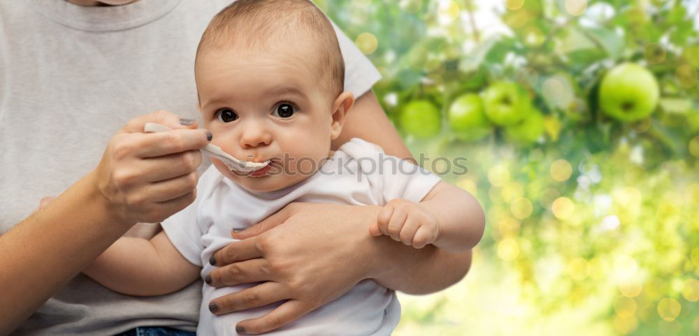 Similar – Daddy feeding toddler a spoonful of baby food