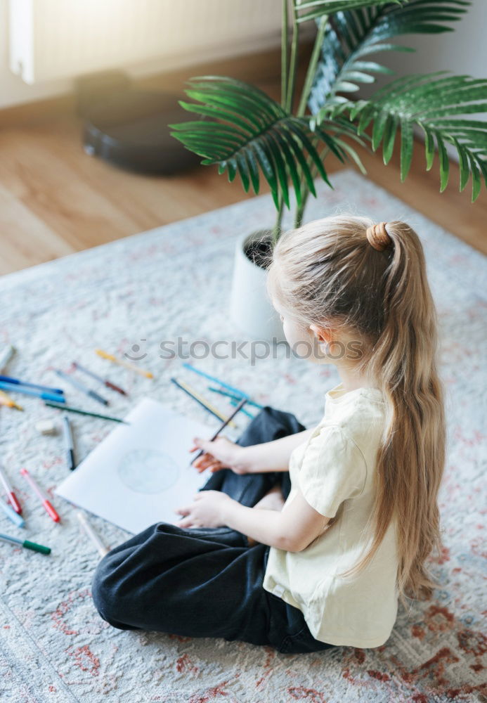 Similar – Image, Stock Photo Little girl doing homework on bed at home