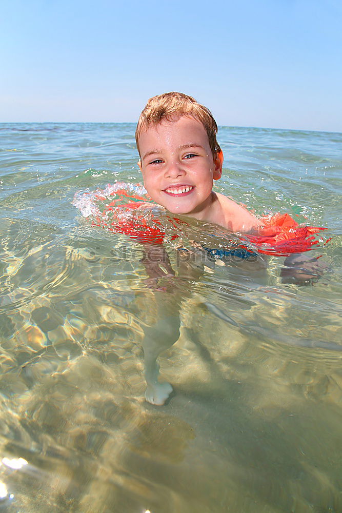 Similar – Image, Stock Photo Little boy with rubber ring