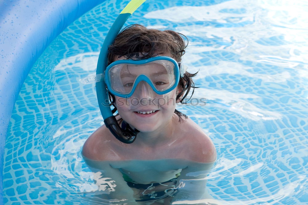 Similar – Image, Stock Photo Cute boy in inflatable ring having fun in the swimming pool