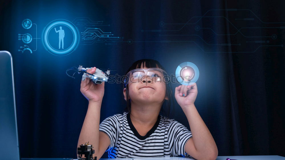 Similar – Image, Stock Photo Little boy sitting in his seat during a flight playing contentedly with a tablet computer in an airplane watched by his mother